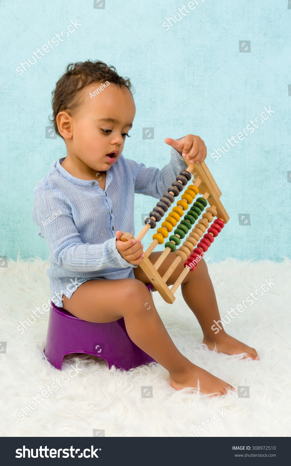 Potty Training Of A Cute African Toddler Boy Playing With An Abacus ...