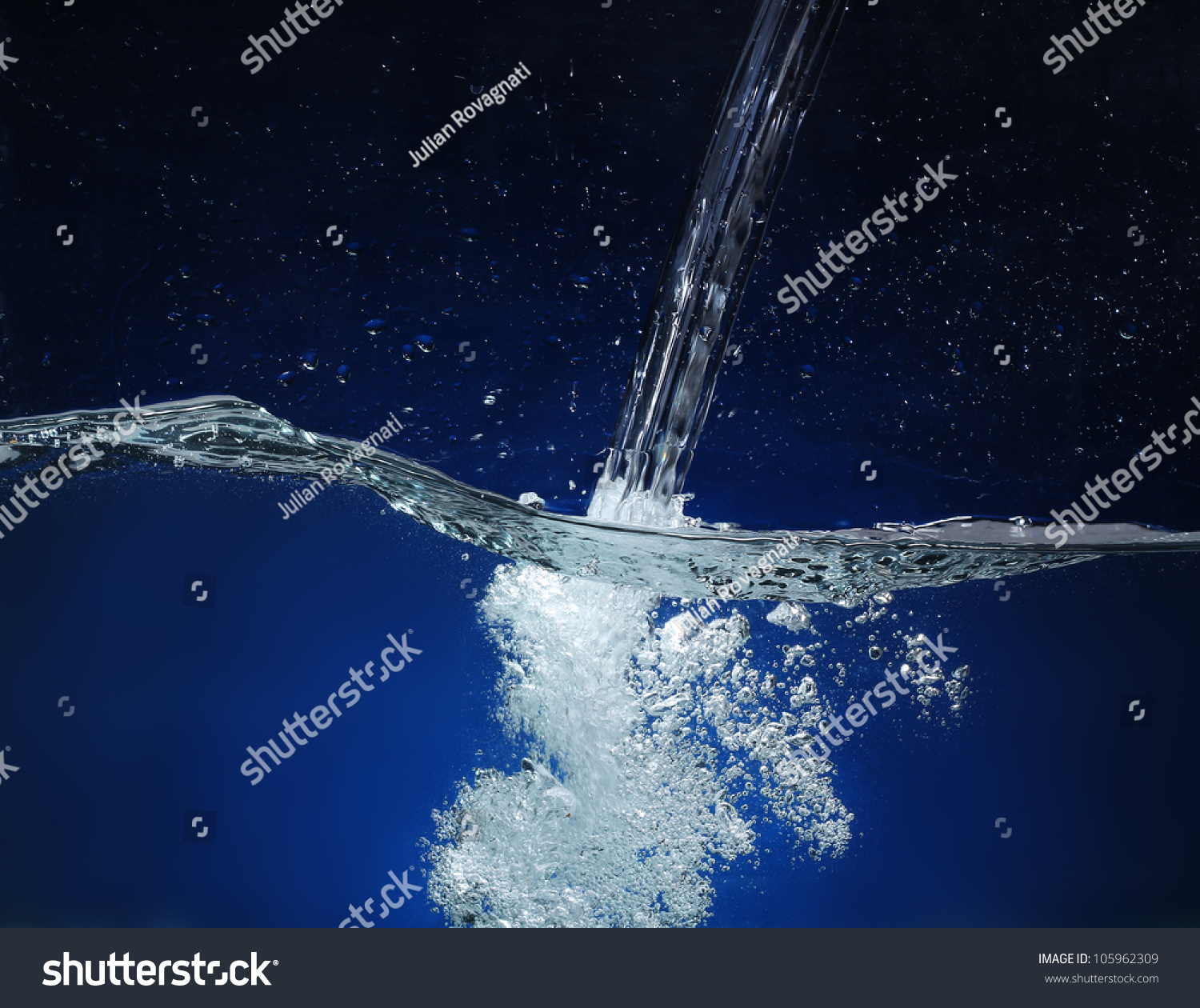 Pouring Water. Splash Image On A Blue Background Stock Photo 105962309 ...