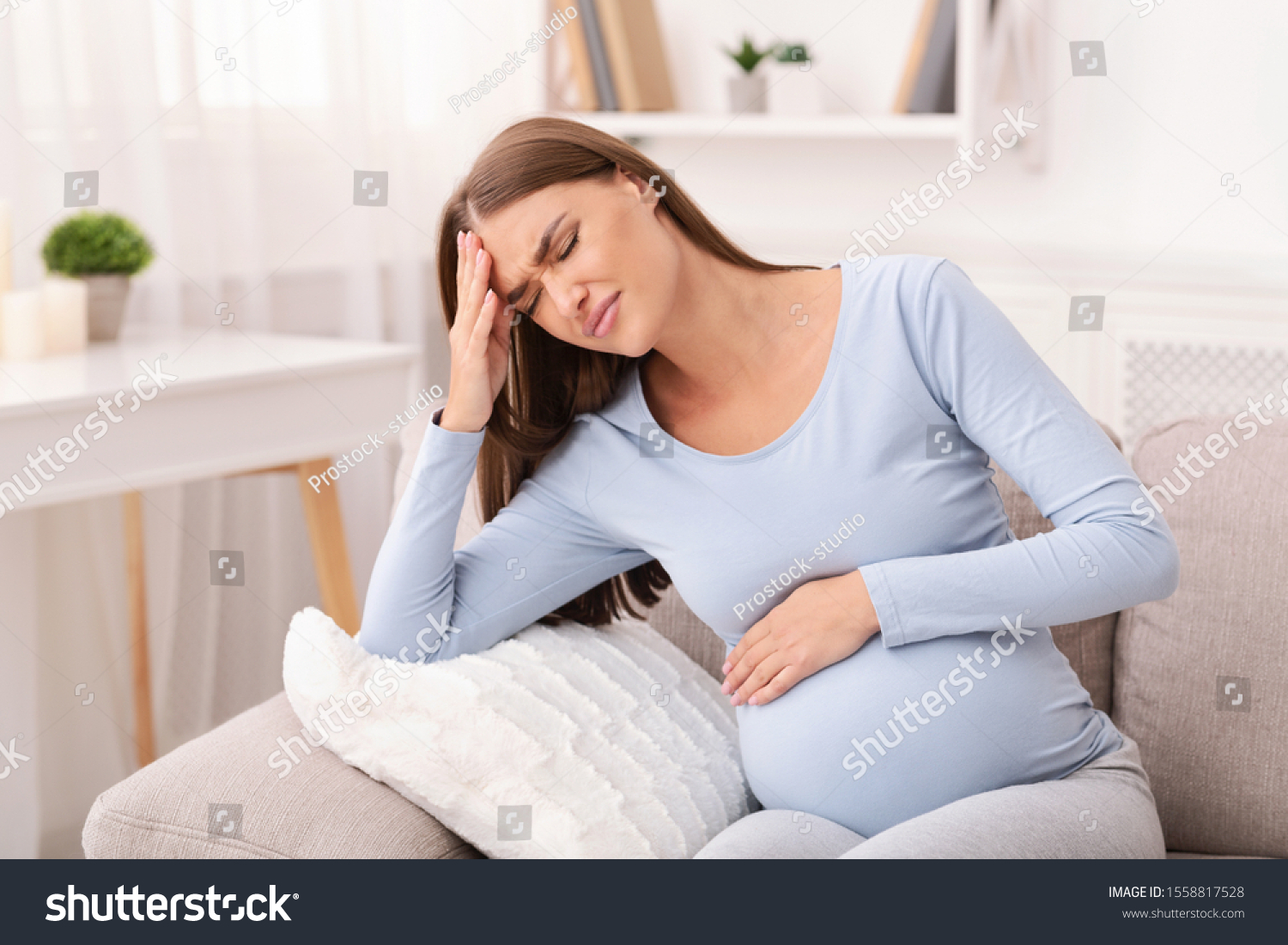 Pregnant Lady Having Headache Touching Head Stock Photo 1558817528 ...