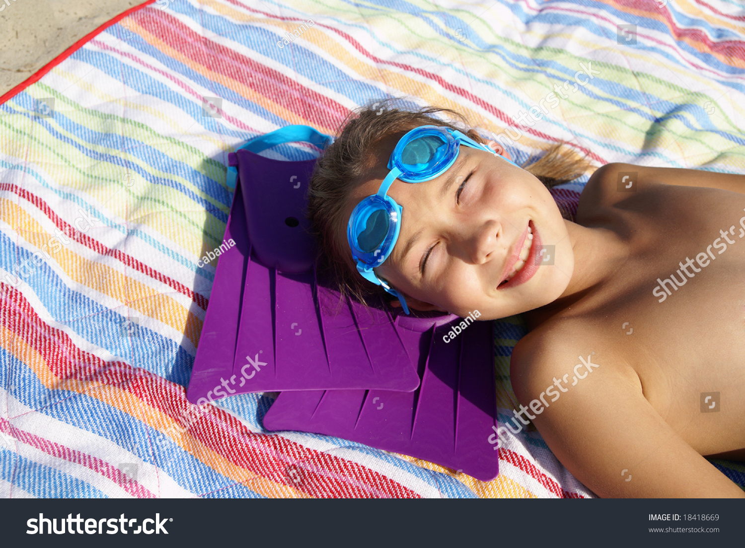 preteen-girl-enjoying-sunbath-on-sea-stock-photo-18418669-shutterstock