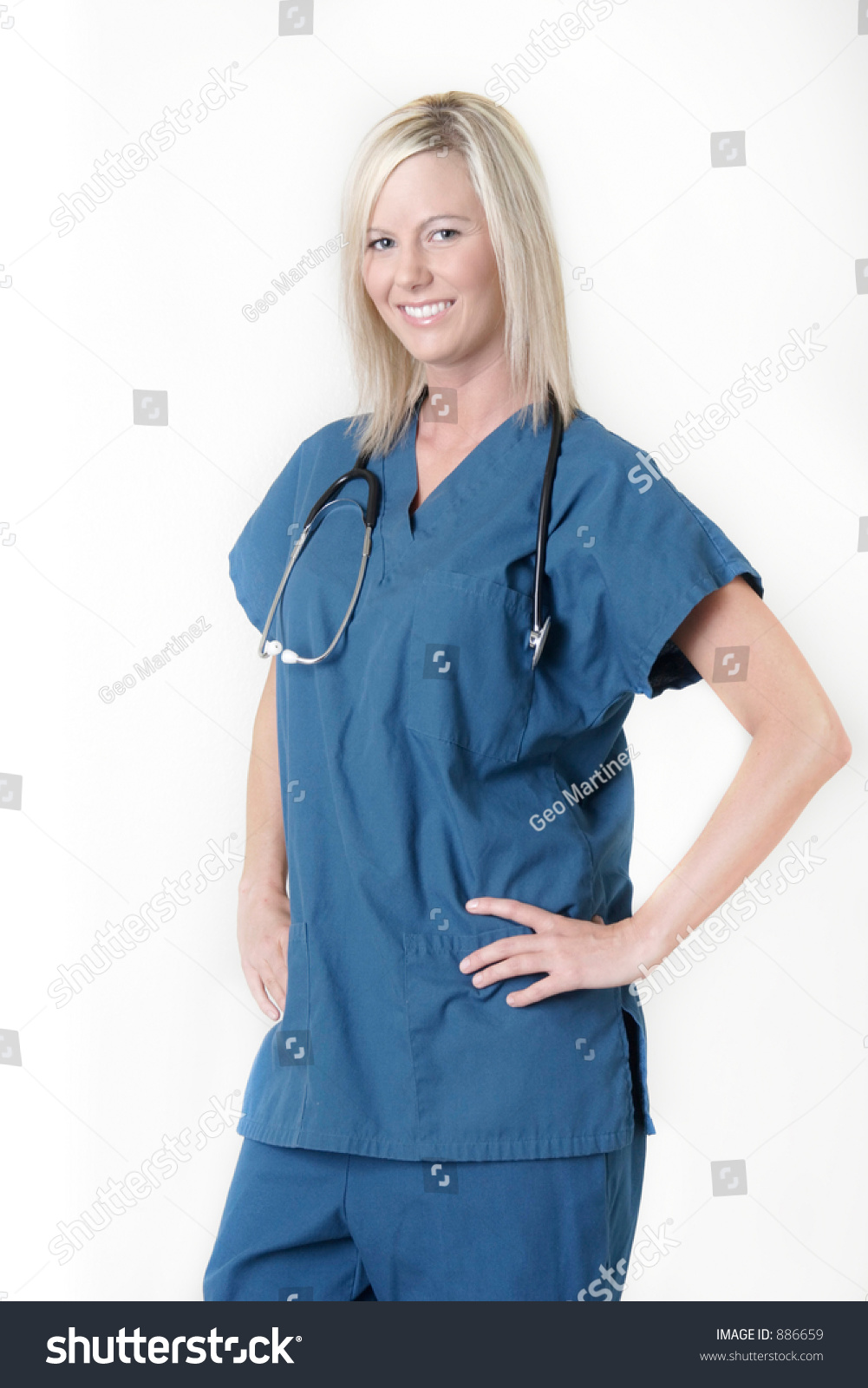 Pretty Blond Nurse With Friendly Smile On White Background Stock Photo ...