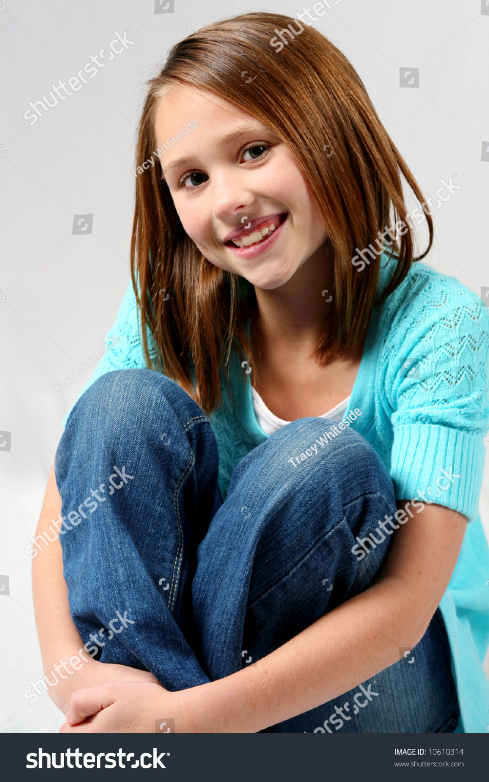 Pretty Blonde Preteen Hugging Knees Smiling Stock Photo 10610314 ...