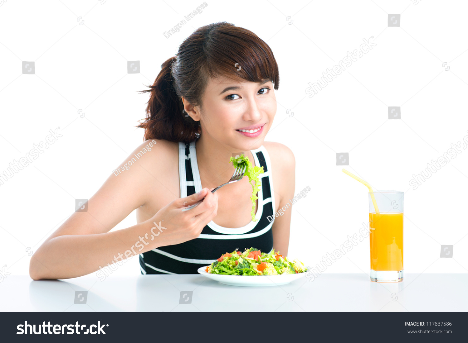 Pretty Girl Eating Her Healthy Diet Lunch, Isolated Against White Stock ...