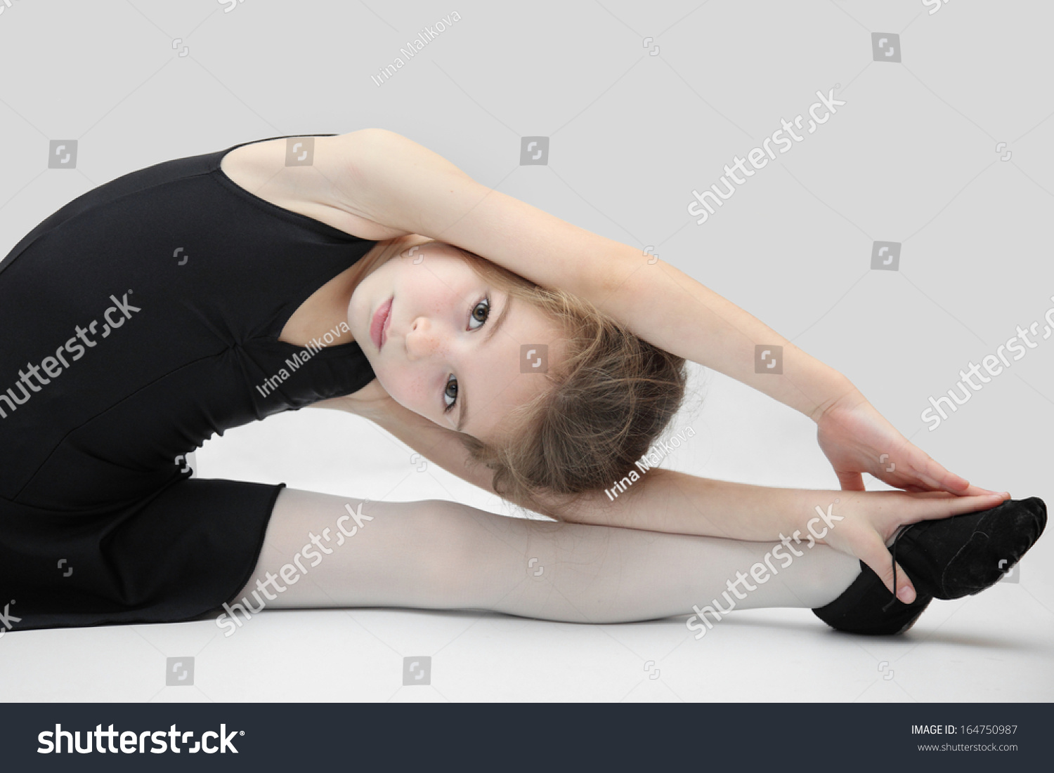 Pretty Little Girl Doing Gymnastics Over White Background. Ballet ...