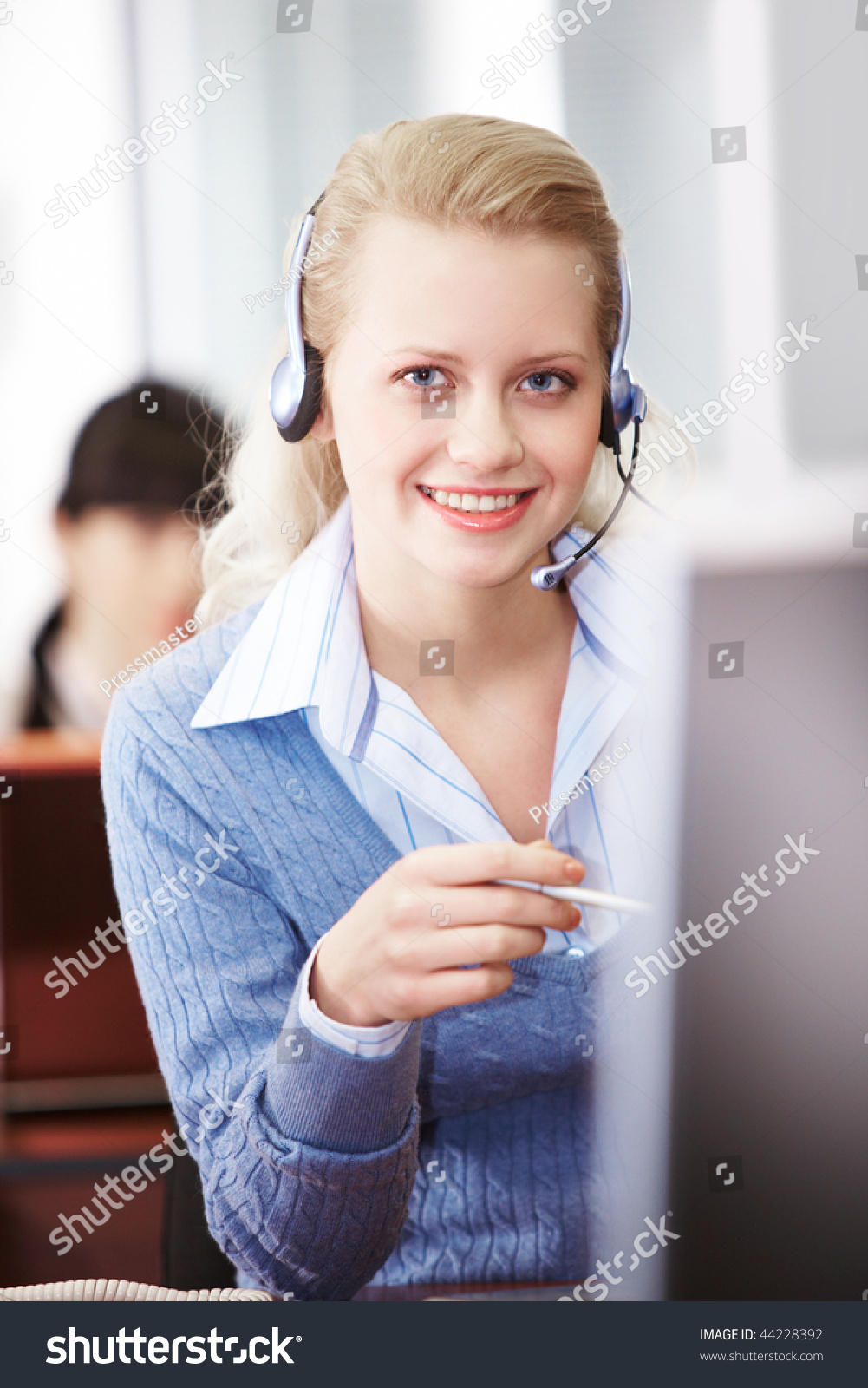 Pretty Secretary Speaking On Headphone In The Office Stock Photo ...