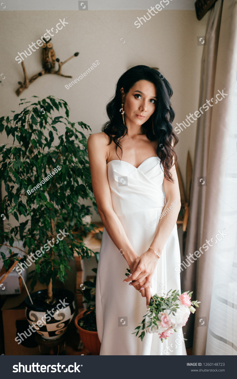 https://image.shutterstock.com/z/stock-photo-pretty-young-caucasian-bride-with-bouquet-of-flowers-posing-indoor-lovely-girl-with-spanish-1260148723.jpg