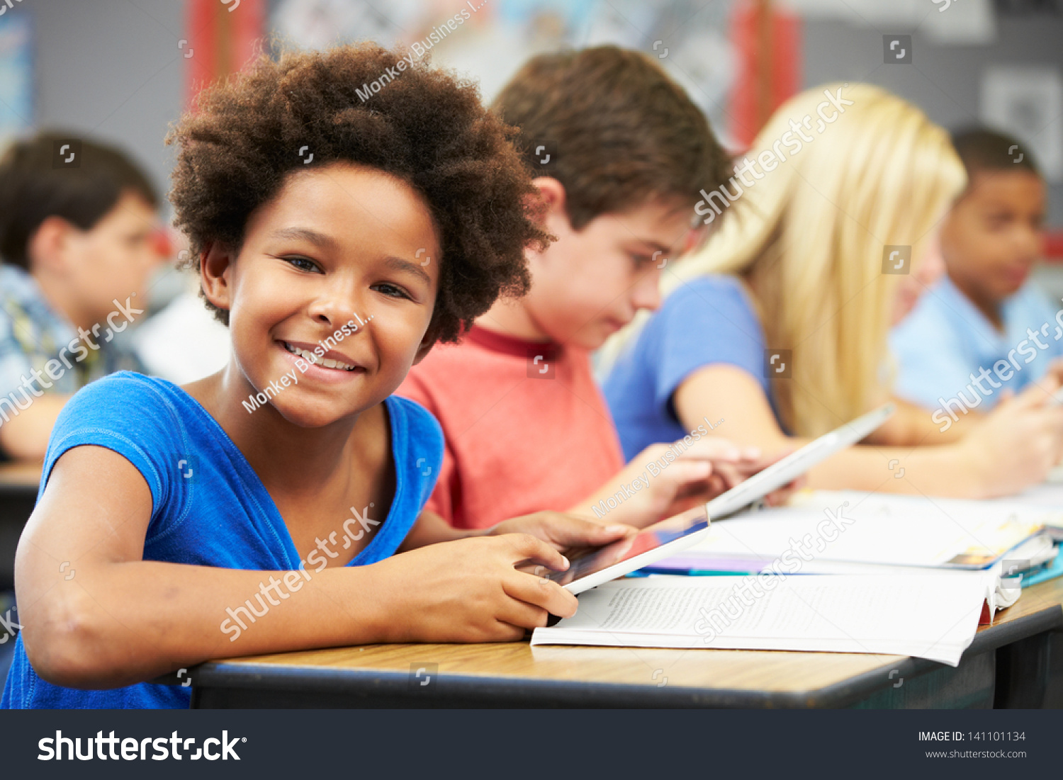 Pupils In Class Using Digital Tablet Stock Photo 141101134 : Shutterstock