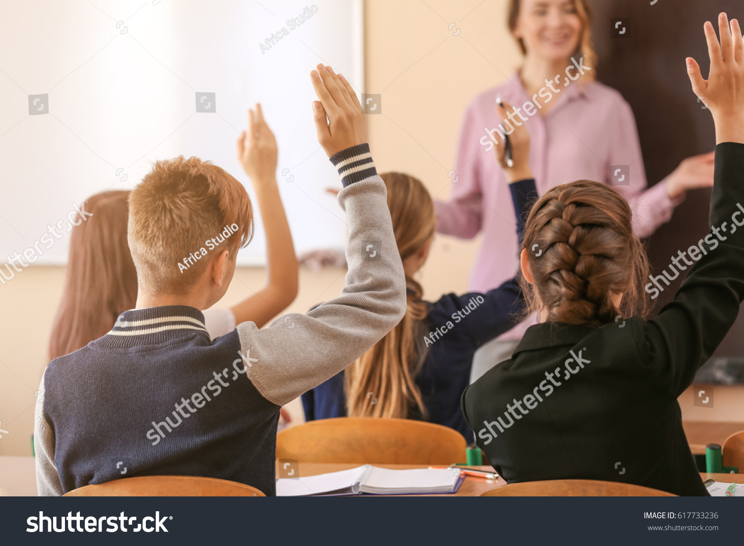 Pupils Listening Teacher Raising Hands Answer Stock Photo 617733236