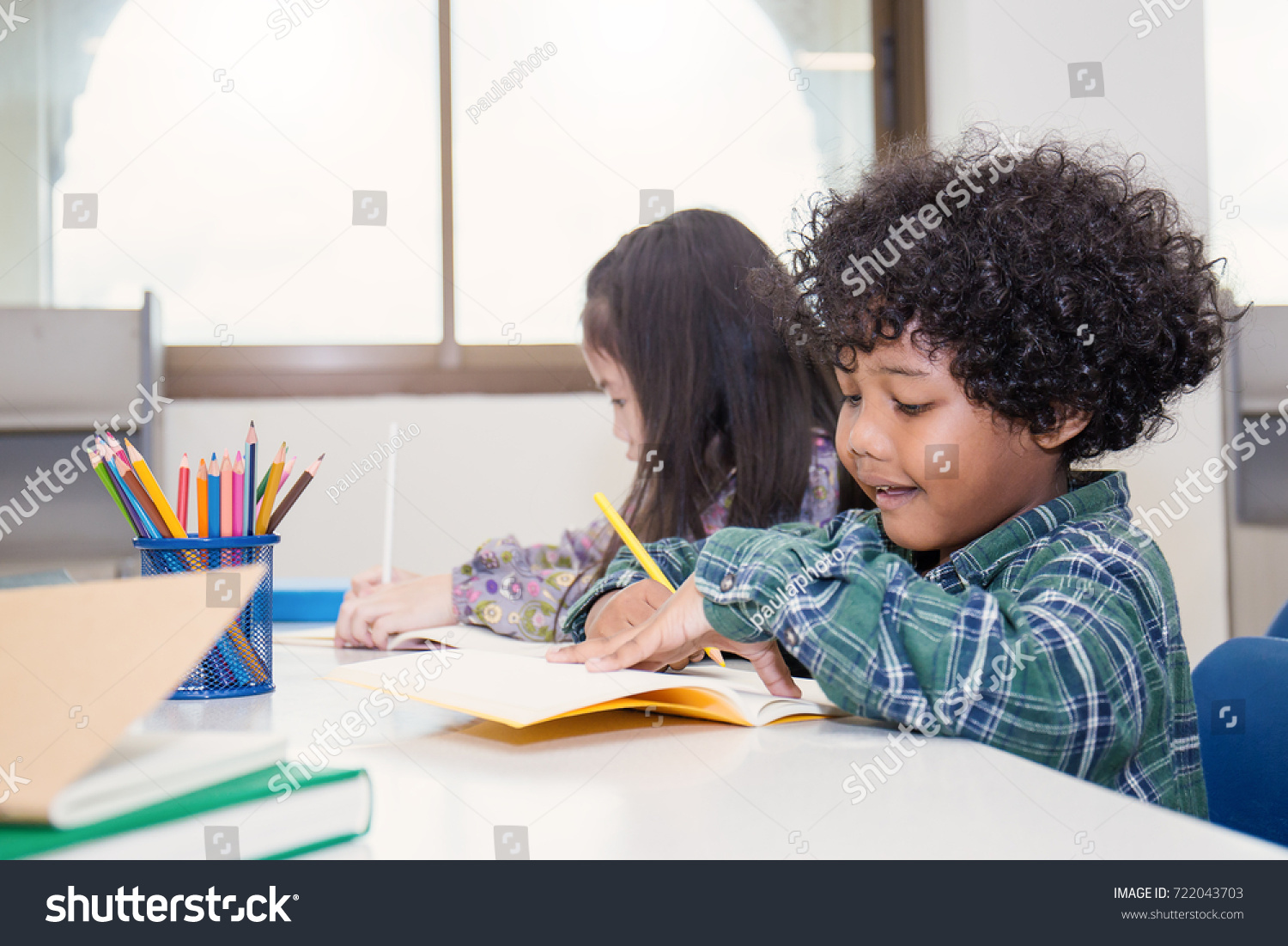 Pupils Studying Desks Classroom Two Little Stock Photo Edit Now