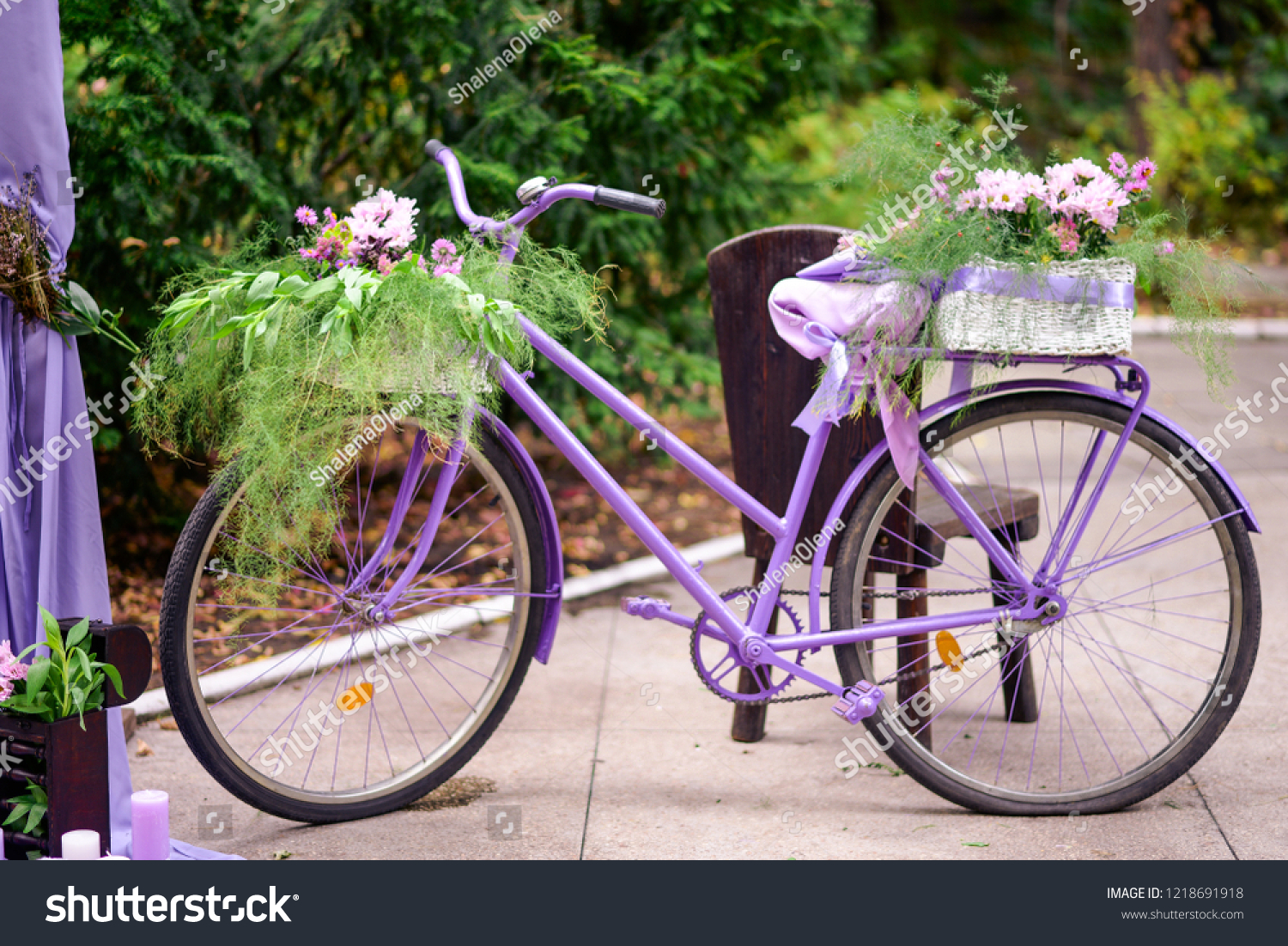 purple bike with basket