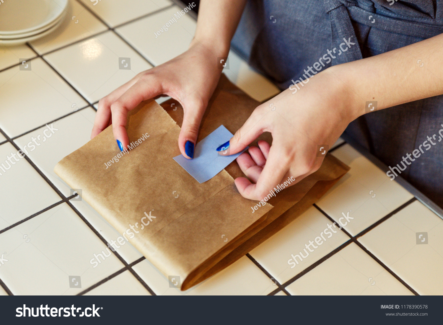Putting Label Sticker On Paper Bag Stock Photo Edit Now 1178390578