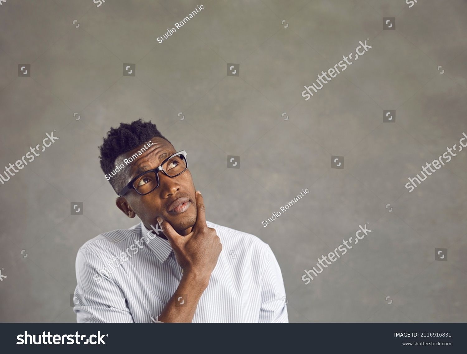 Puzzled Confused Darkskinned Man Looks Scratches Stock Photo 2116916831