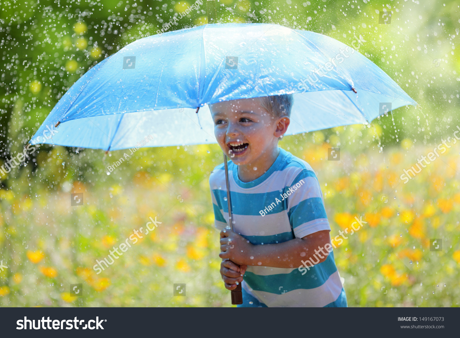 Rain And Sunshine With A Smiling Boy Holding An Umbrella And Running ...