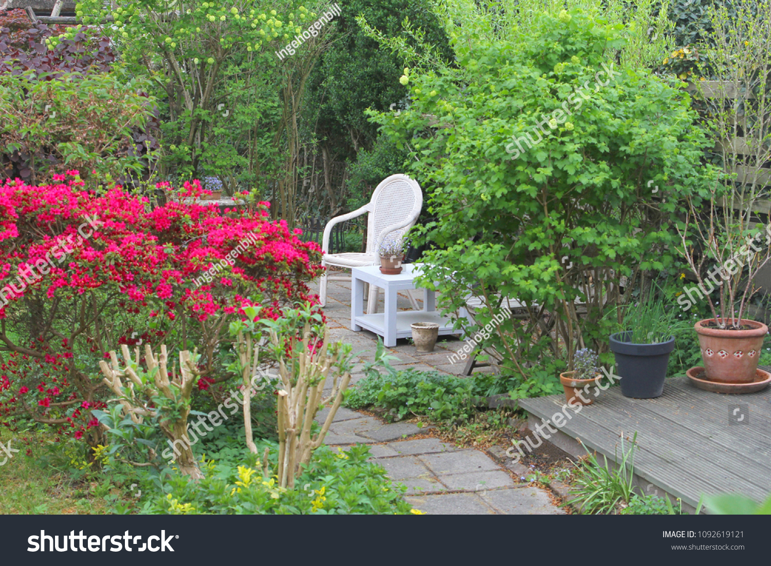 Rattan Chair Patio Table Between Flowering Stock Photo Edit Now 1092619121