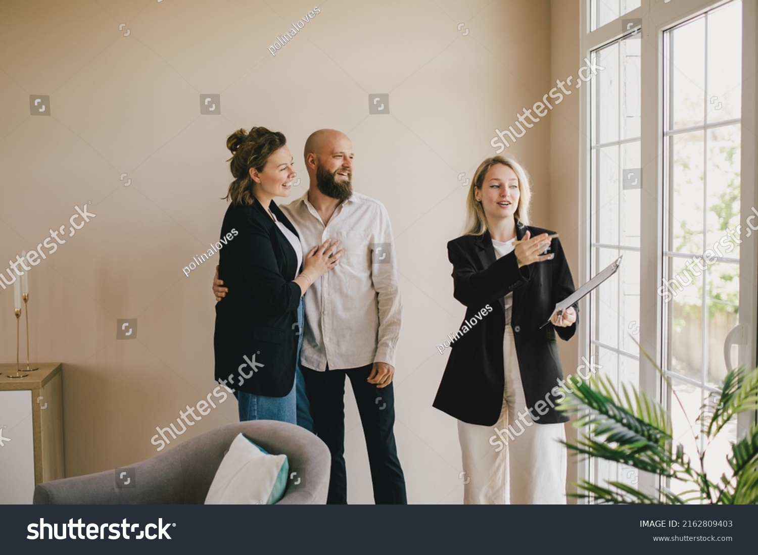 Real Estate Agent Demonstrating New Apartment Stock Photo 2162809403