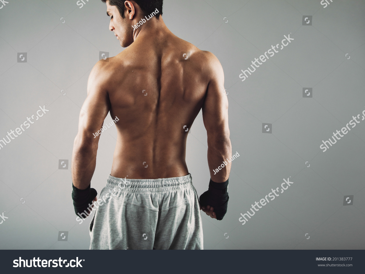 Rear View Of Strong Young Male Boxer. Fitness Male Model Wearing Boxing ...