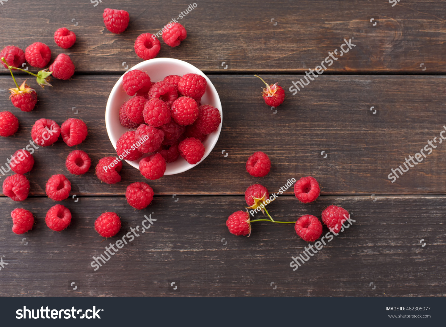Raspberries in a white ceramic bowl Top view Ripe and