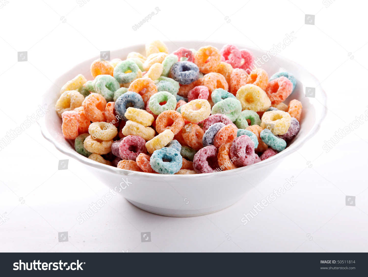 Red, Green, Yellow And Orange Cereal Fruit On White Dish Stock Photo ...