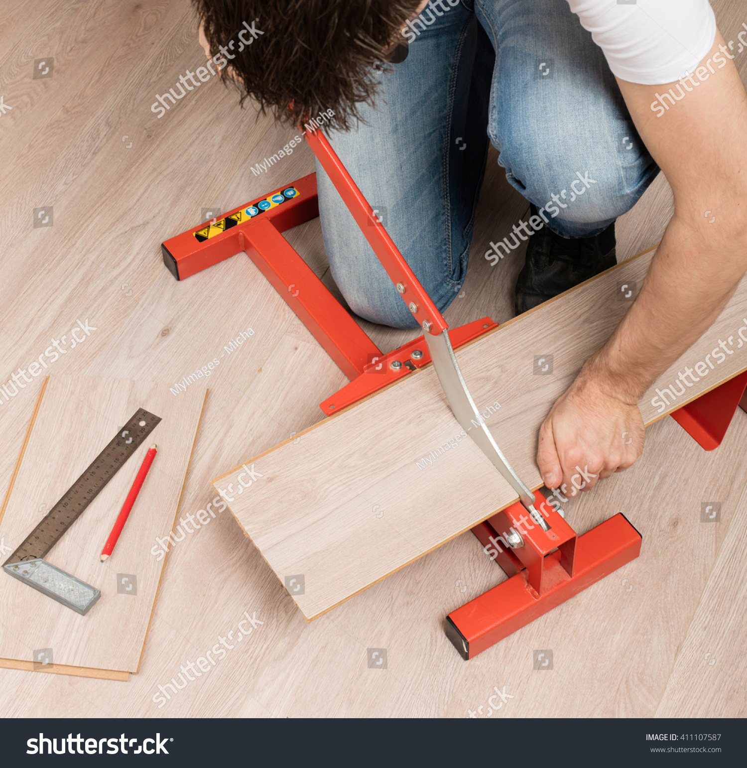 Red Tool Cutting Laminate On Laminate Stock Photo Edit Now