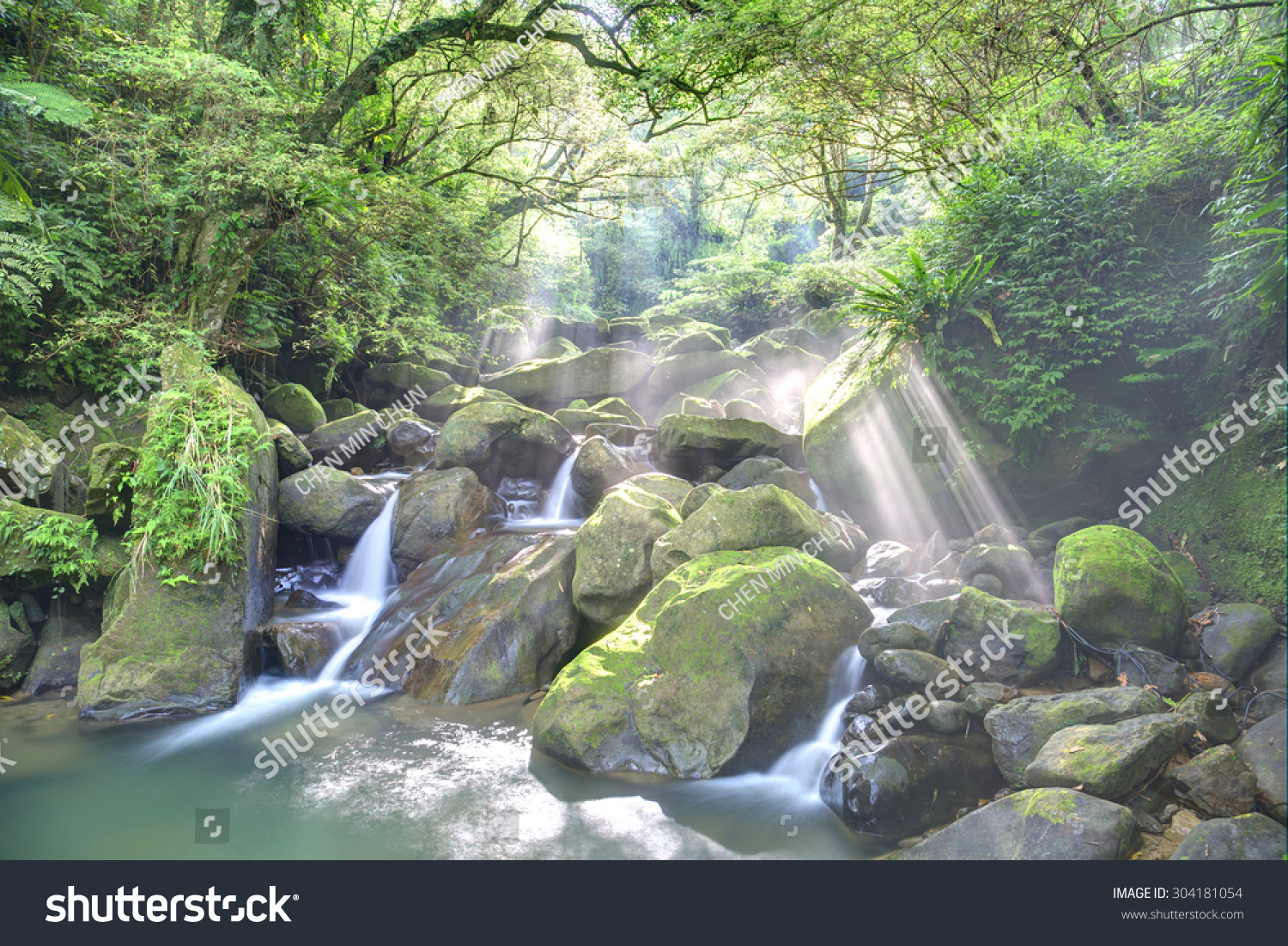 Refreshing Cascades In A Mysterious Ravine Of Lush Forest With Sunlight ...