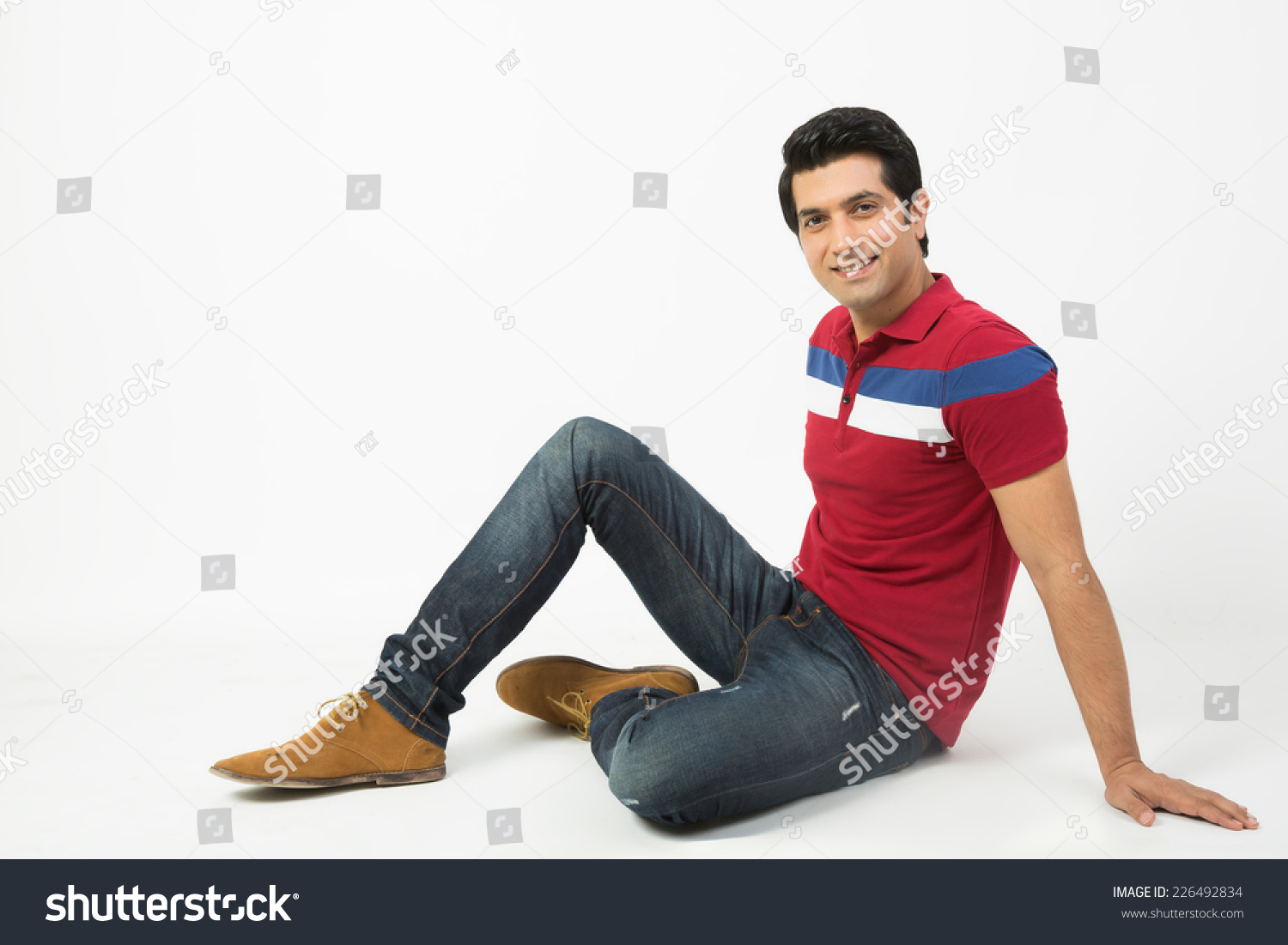 Relaxed Indian Man Sitting On Floor Stock Photo (Edit Now) 226492834