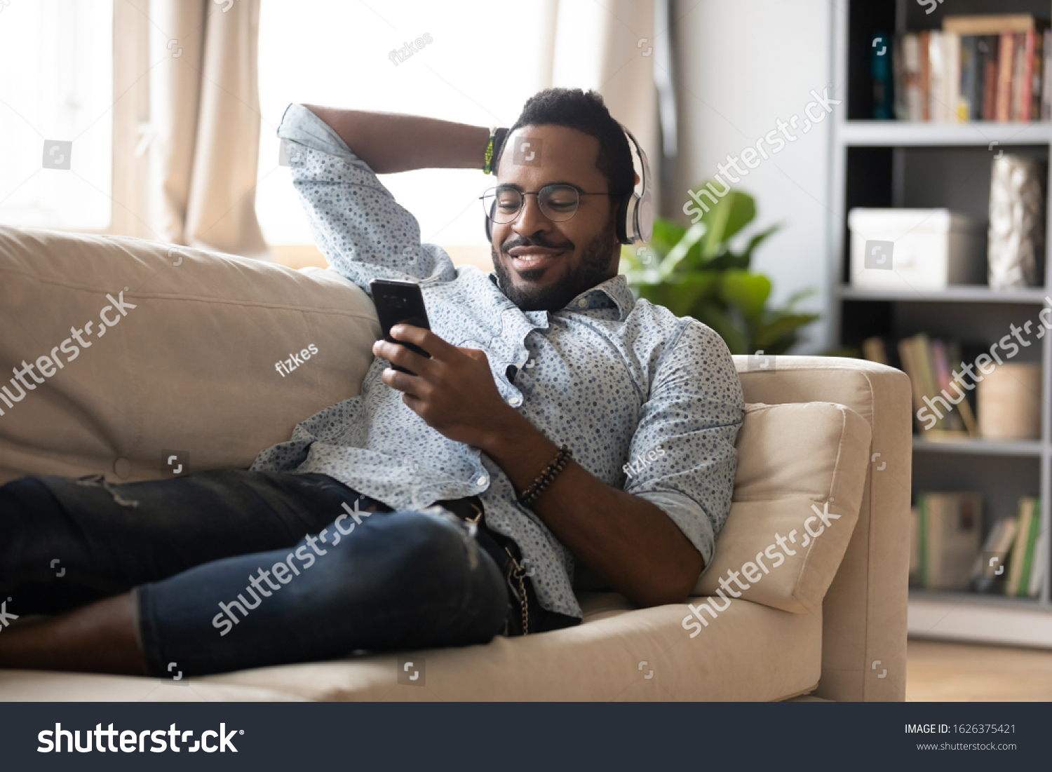 Relaxed Millennial African Man Wear Wireless Stock Photo 1626375421 ...