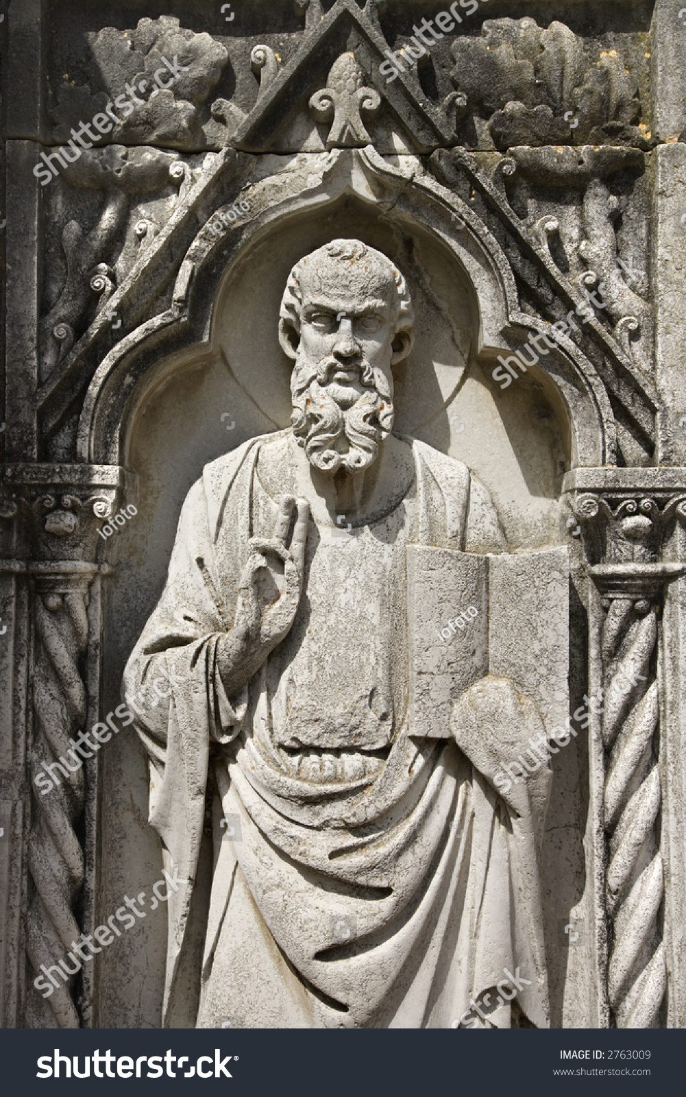 Relief Sculpture Of Bearded Male Figure Standing With Book And Holding ...