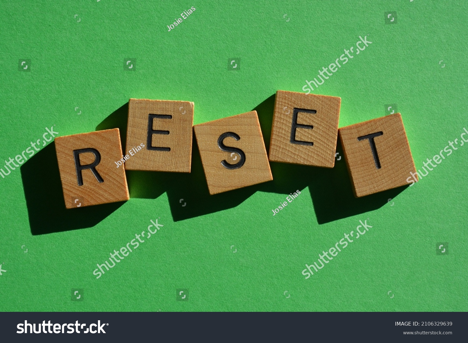 reset-word-wooden-alphabet-letters-isolated-stock-photo-2106329639