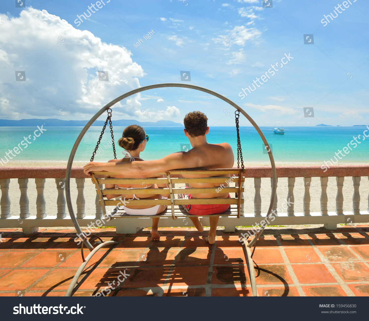 Resting Happy Couple Swinging On Swing Stock Photo Edit Now