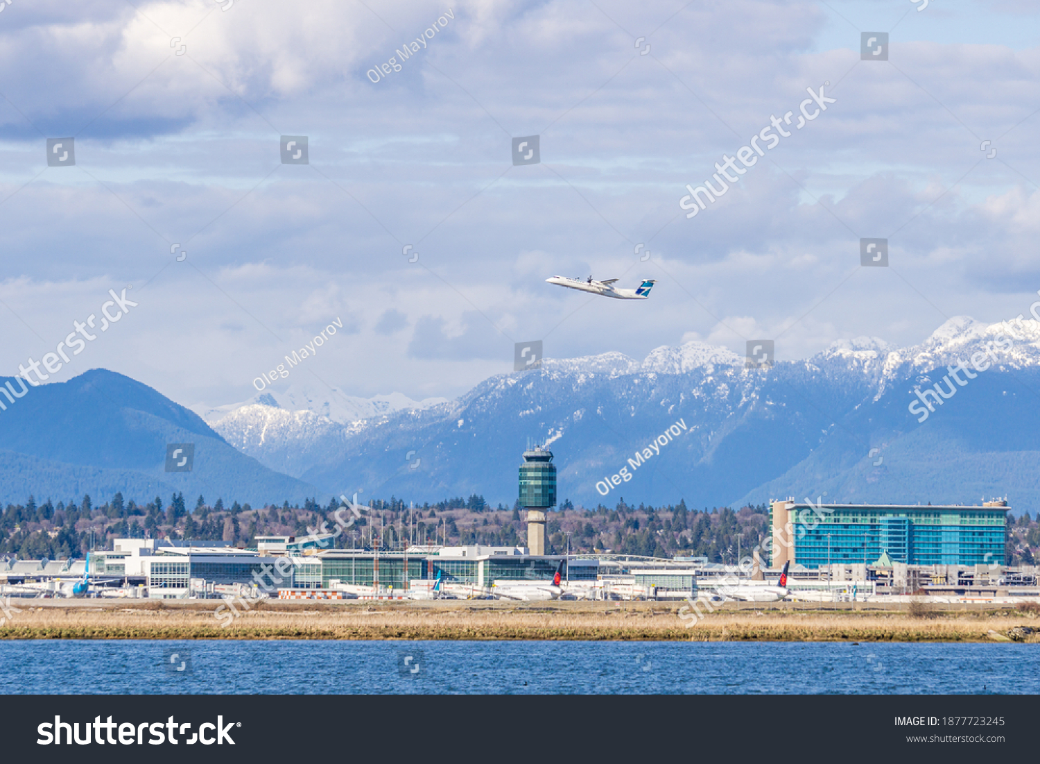 502 Yvr Airplane Images Stock Photos Vectors Shutterstock   Stock Photo Richmond Canada April Vancouver International Airport Yvr With The Coast Mountains In 1877723245 