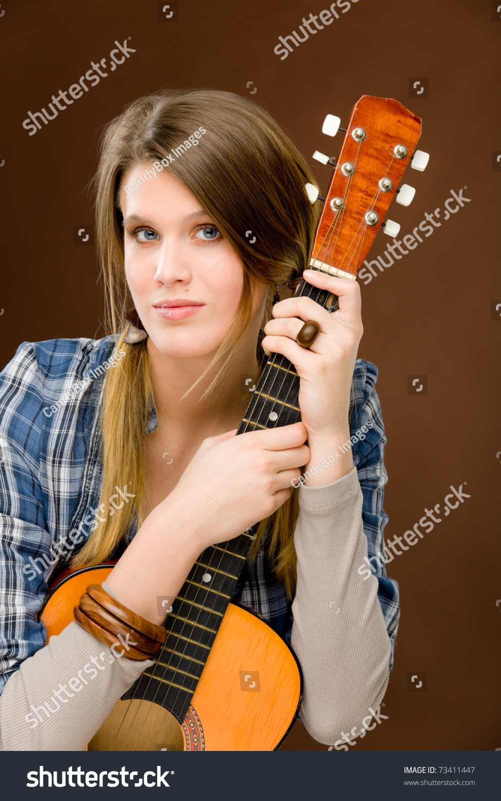 Rock Musician - Young Fashion Female Model Posing With Guitar Stock ...