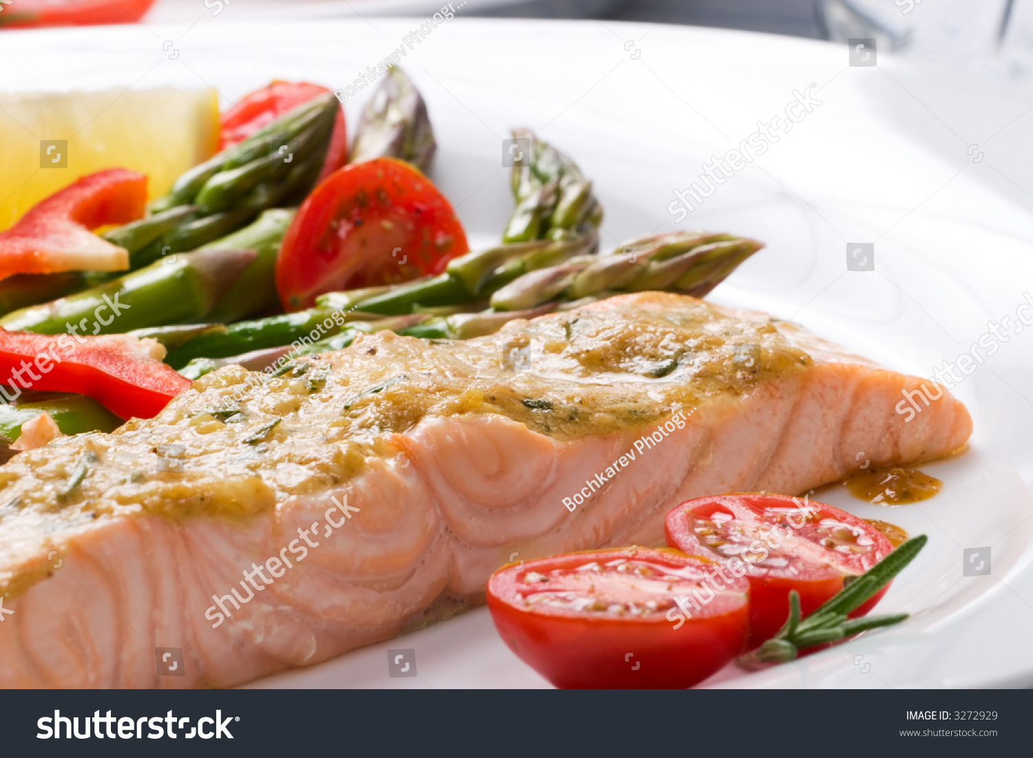 Rosemary Roasted Salmon Served With Asparagus, Cherry Tomatoes, Red ...