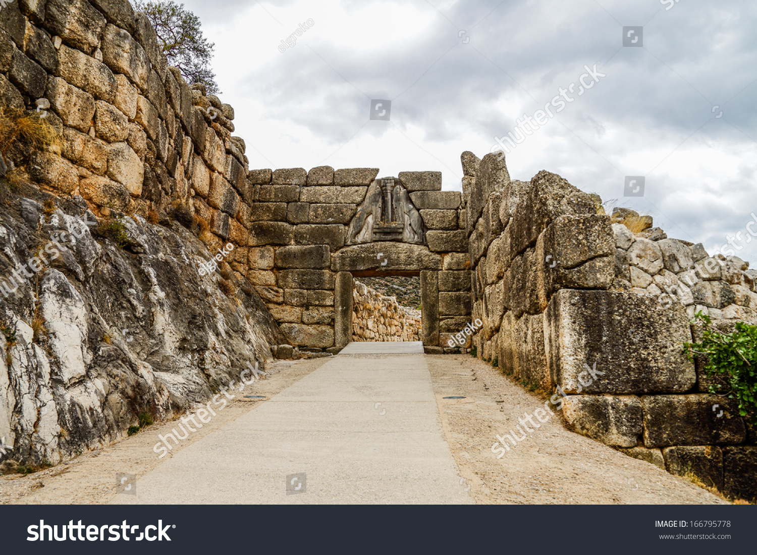 Ruins Of Lion'S Gate In Ancient City Of Mycenae Against Cloudy Sky ...