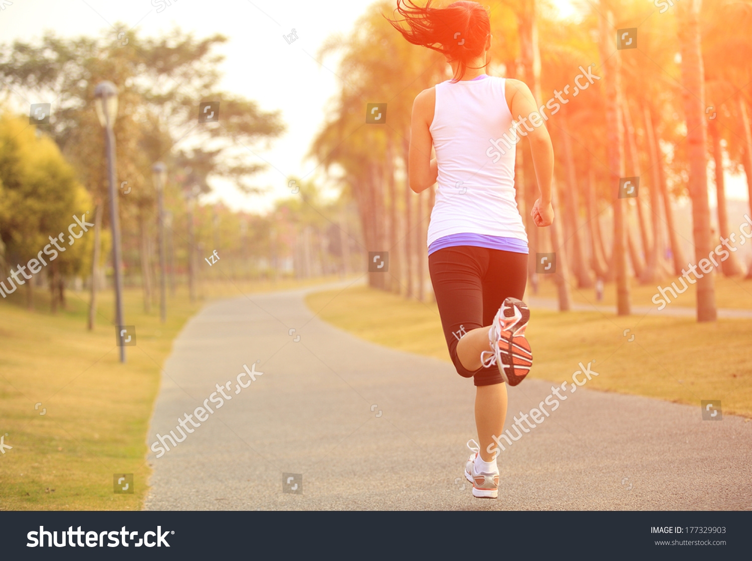 Runner Athlete Running At Tropical Park. Woman Fitness Sunrise Jogging ...