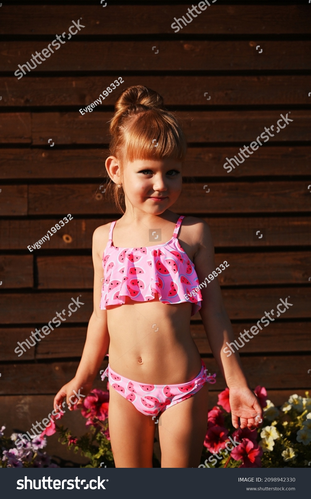 little girls instead bikini 111 Little Girls Pink Swimsuit Brunette Stock Photos and ...