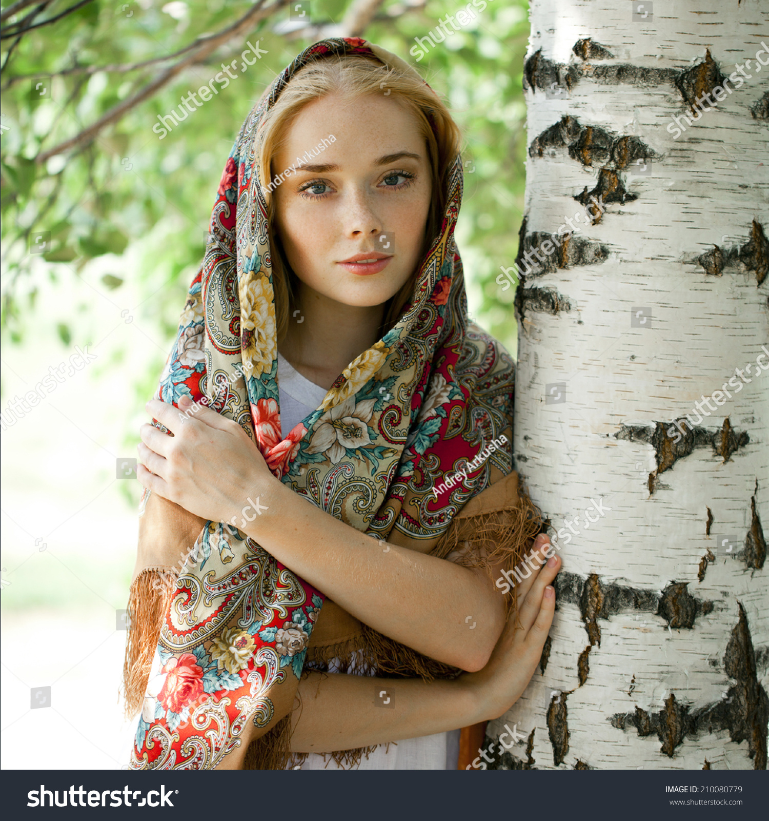 https://image.shutterstock.com/z/stock-photo-russian-beauty-woman-in-the-national-patterned-scarf-210080779.jpg