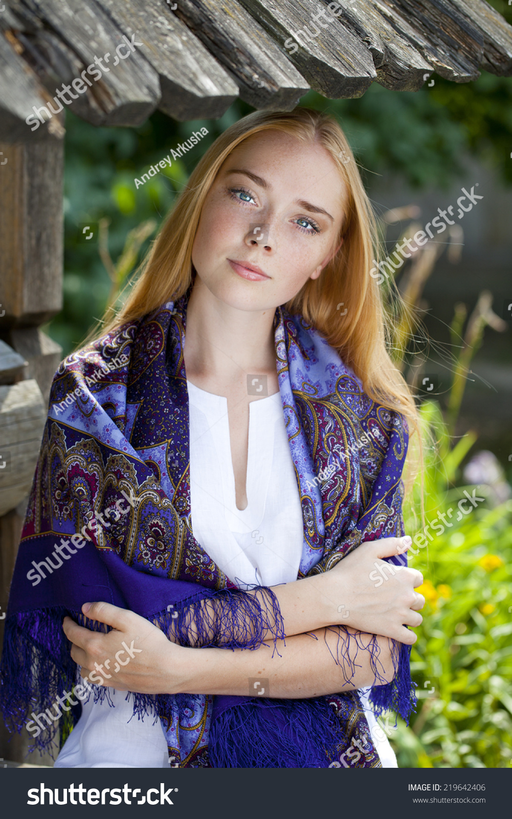 https://image.shutterstock.com/z/stock-photo-russian-beauty-woman-in-the-national-patterned-scarf-219642406.jpg