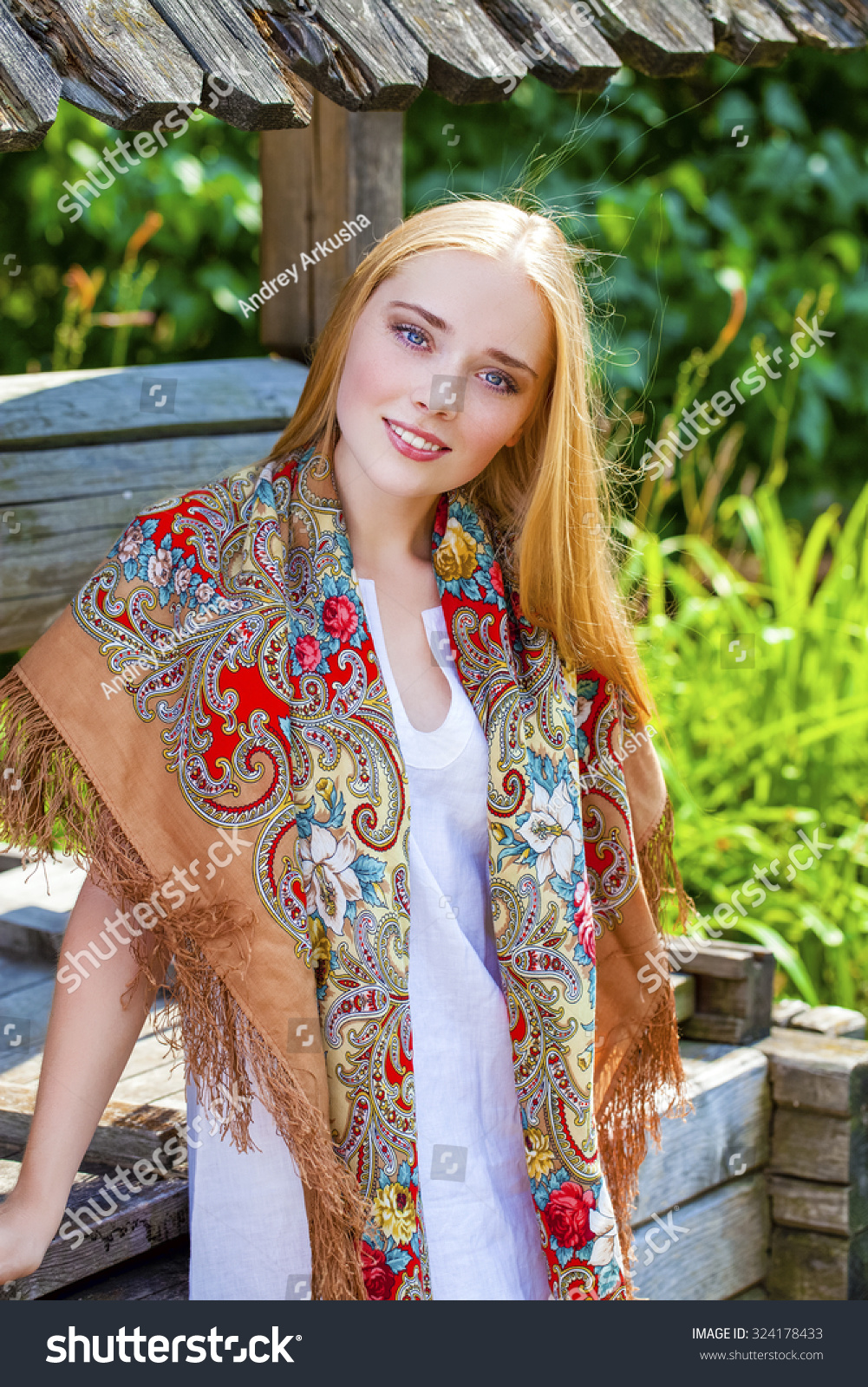 https://image.shutterstock.com/z/stock-photo-russian-beauty-woman-in-the-national-patterned-scarf-324178433.jpg