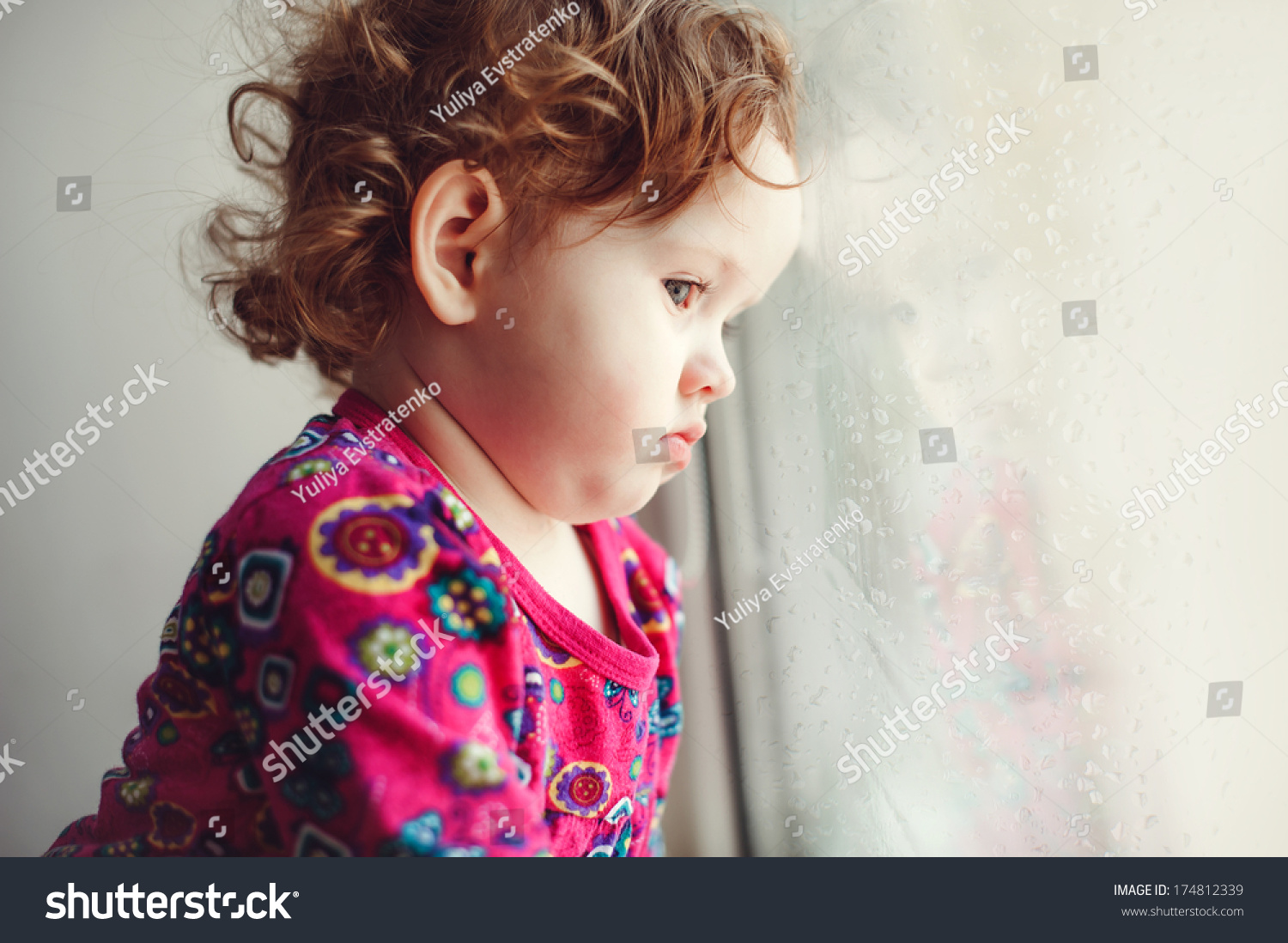 Sad Little Girl Looking Out Window Stock Photo (Edit Now) 174812339