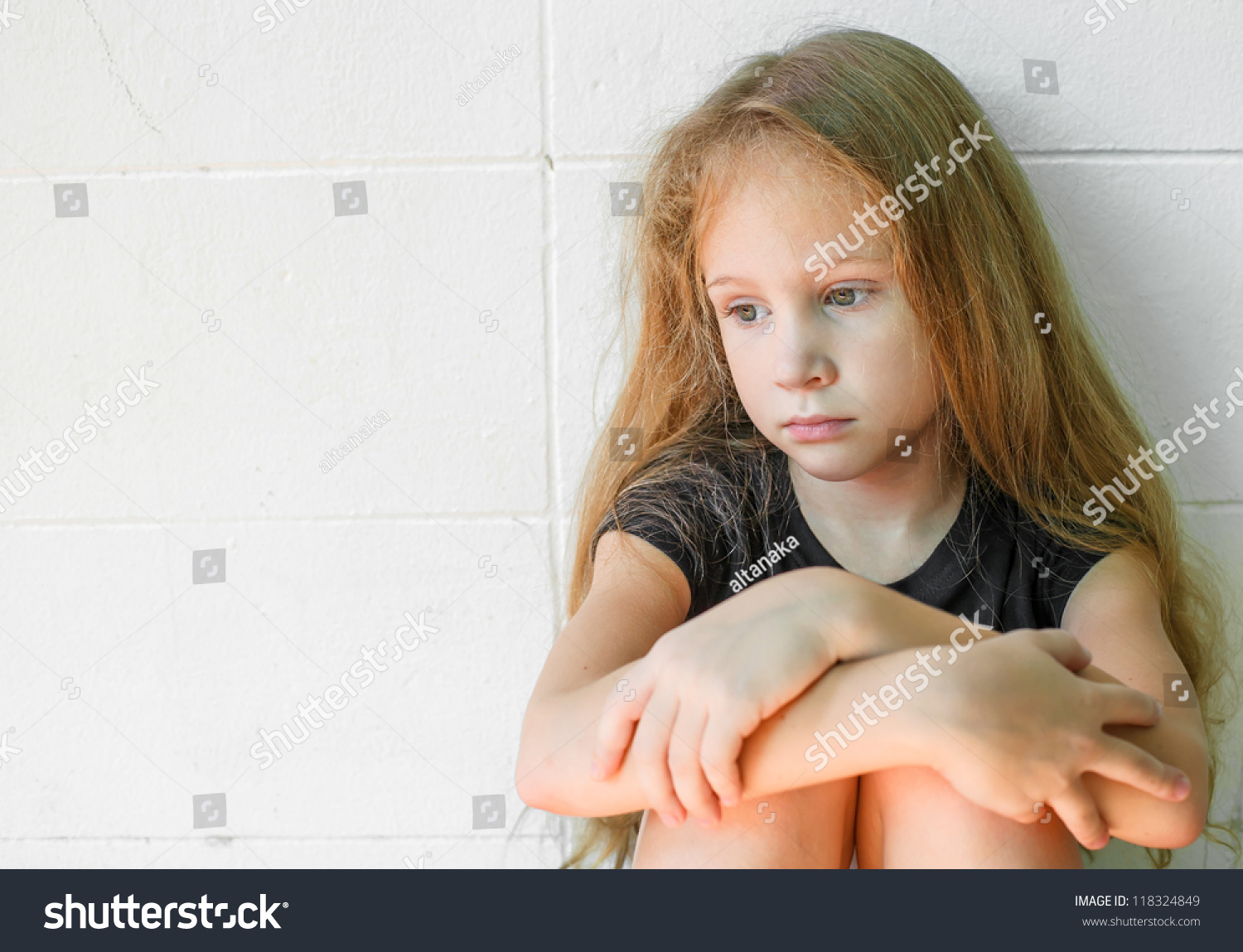 Sad Little Girl Sitting Near Wall Stock Photo 118324849 - Shutterstock