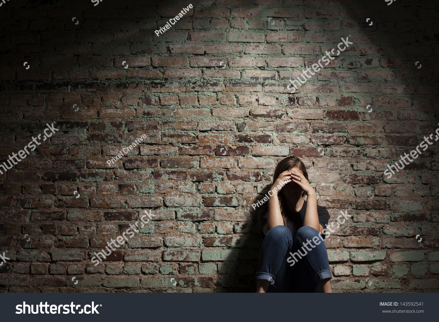 Sad Woman Sitting Alone Against Brick Stock Photo 143592541 - Shutterstock