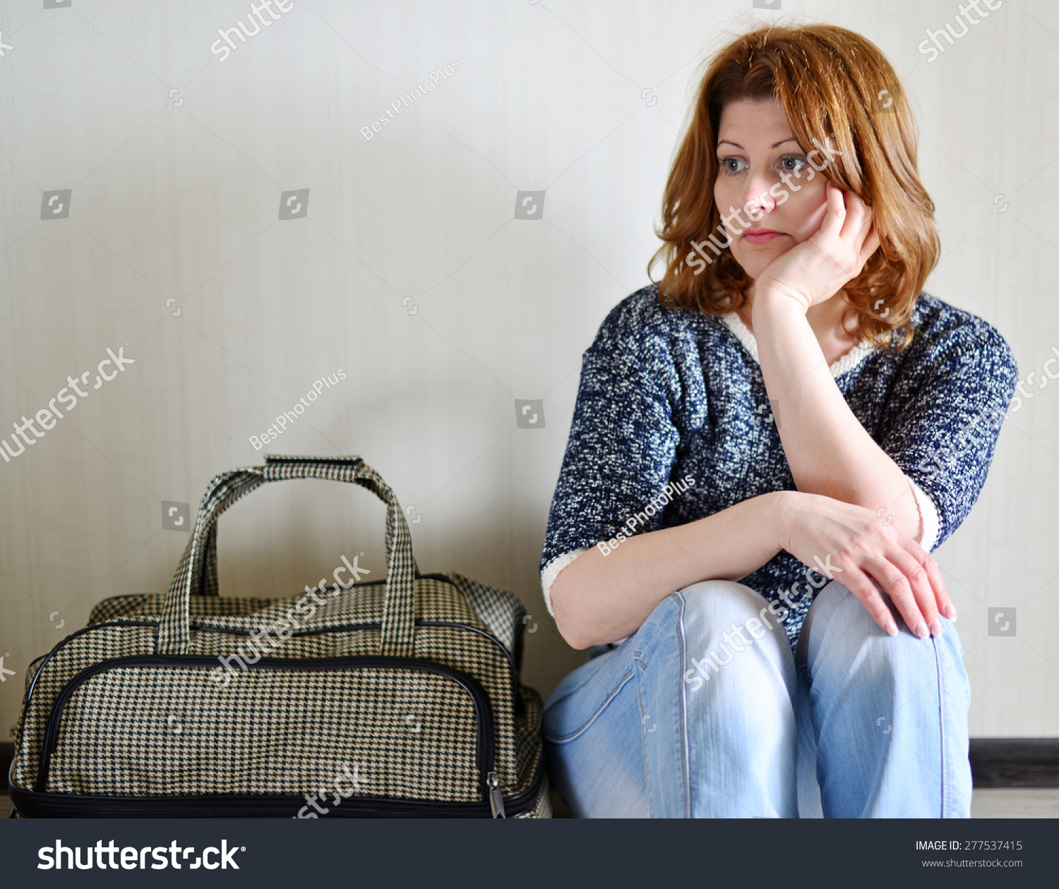 Sad Woman Sitting Near Wall Suitcase Stock Photo 277537415 | Shutterstock