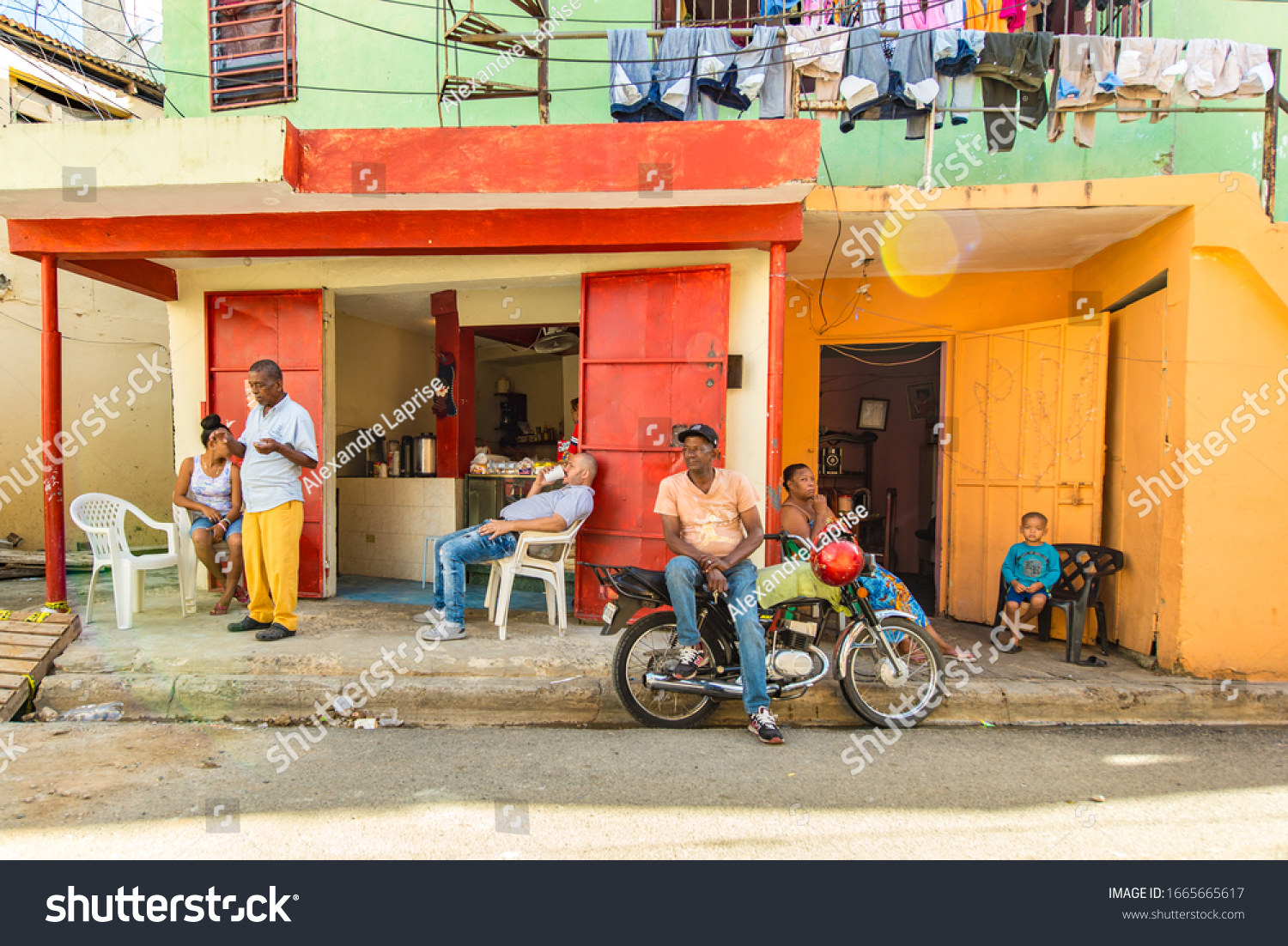 stock-photo-santo-domingo-dominican-republic-april-group-of-relaxed-people-some-sitting-having-a-1665665617.jpg
