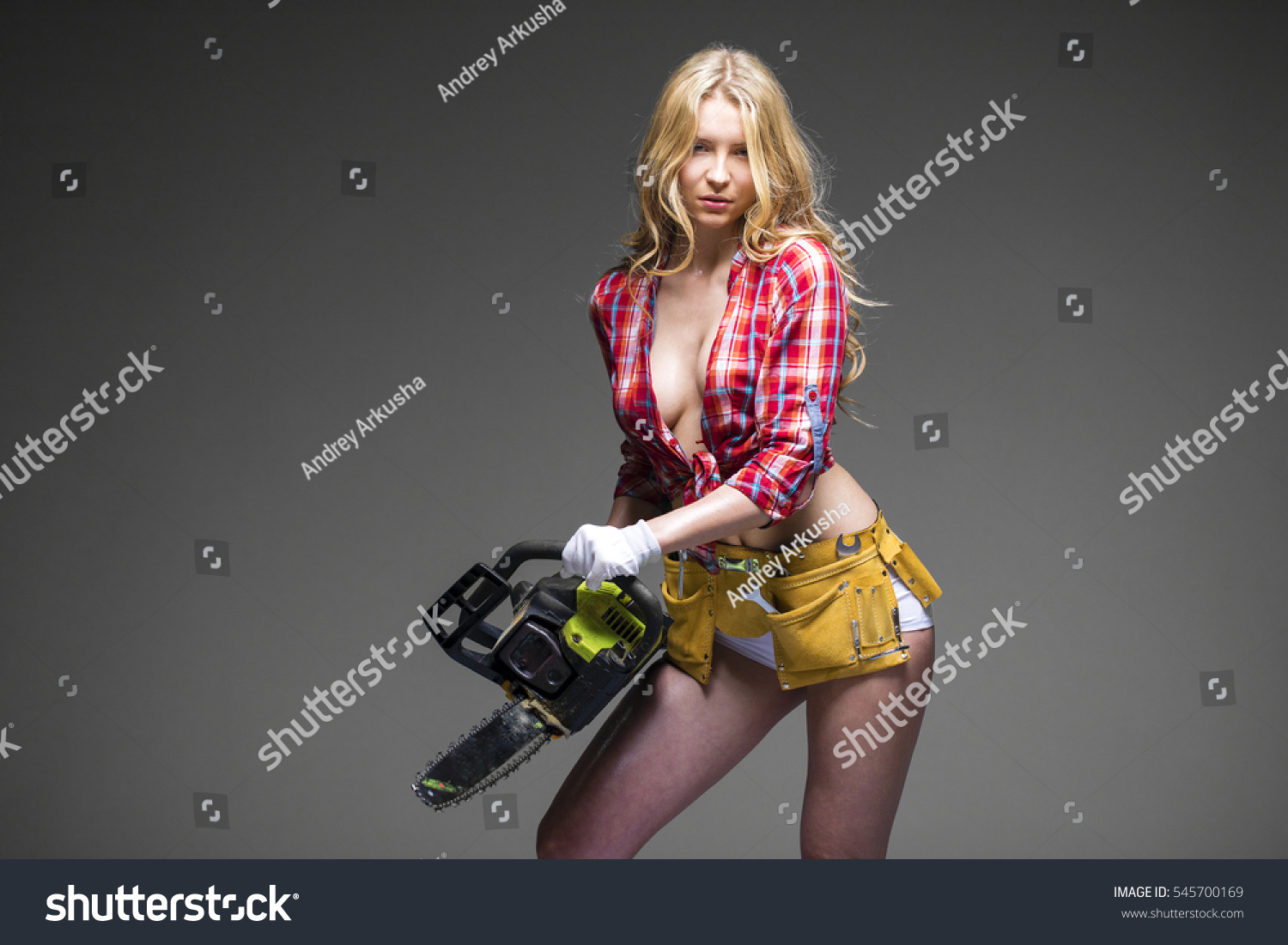 https://image.shutterstock.com/z/stock-photo-satisfaction-project-beautiful-hot-blond-woman-hold-a-chainsaw-over-gray-background-isolated-545700169.jpg