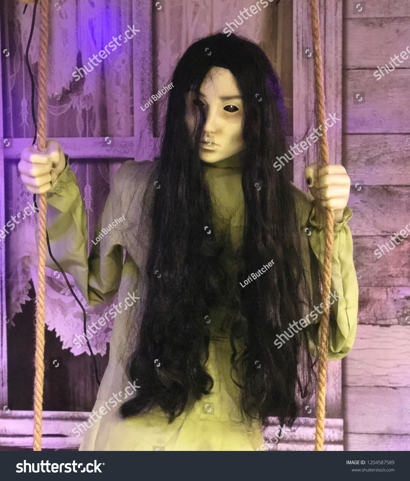 halloween doll on swing