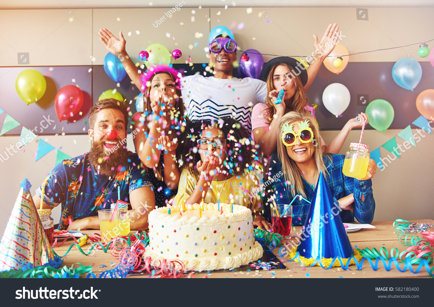 Scattered Confetti Falling Around Group Party Stock Photo (Edit Now ...