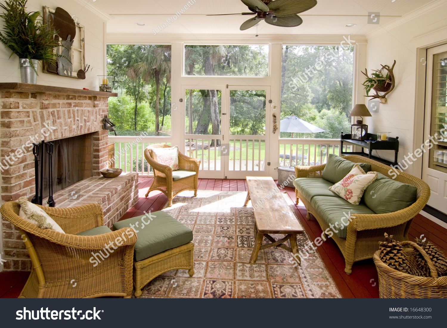 Screen Porch Fireplace Wicker Furniture Stock Photo 16648300