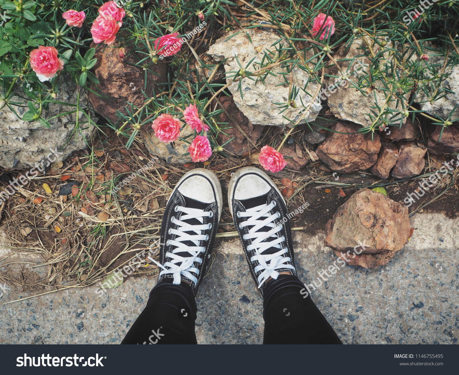 black sneakers with flowers