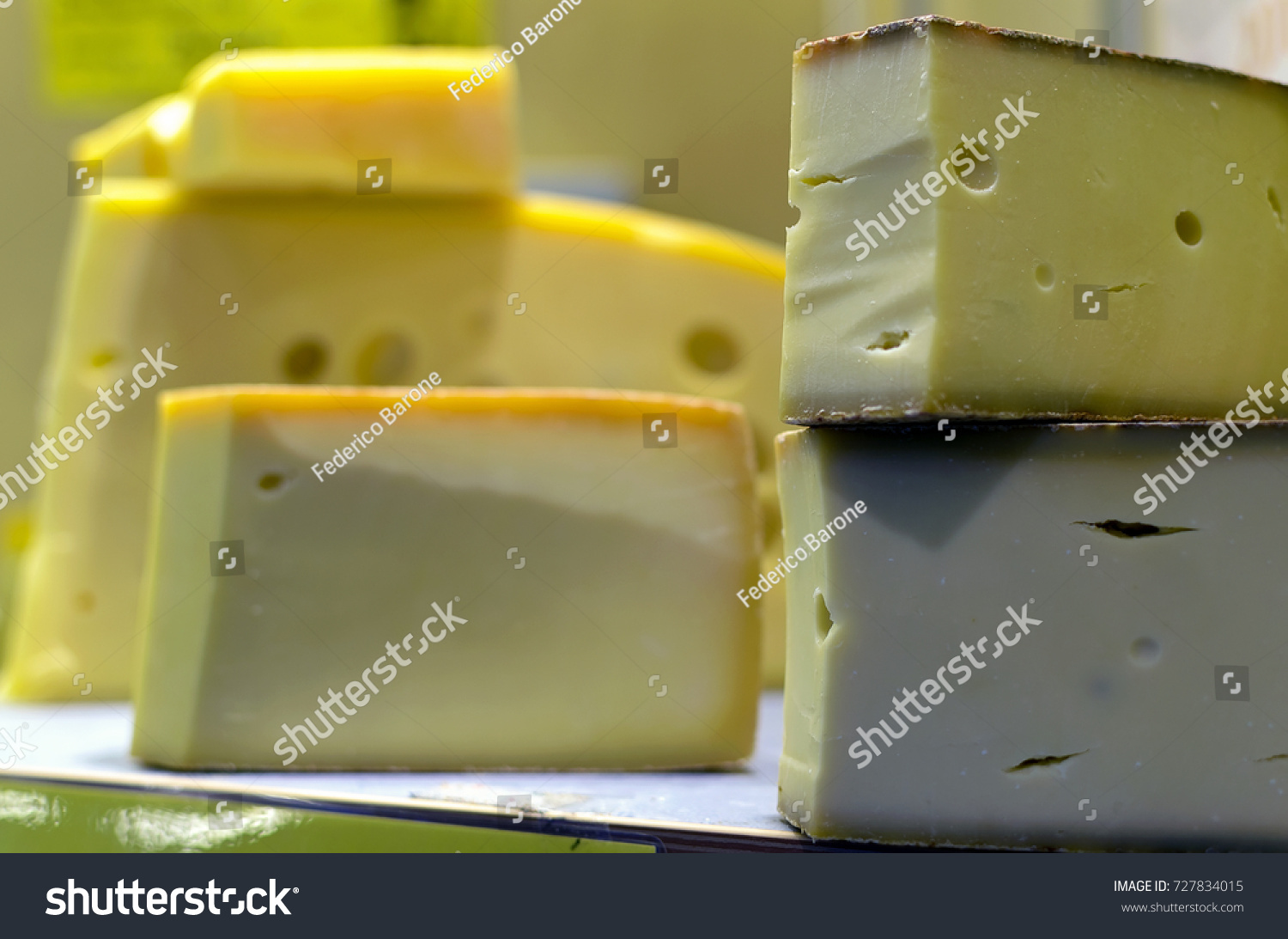 stock-photo-semi-hard-cheeses-at-a-retai
