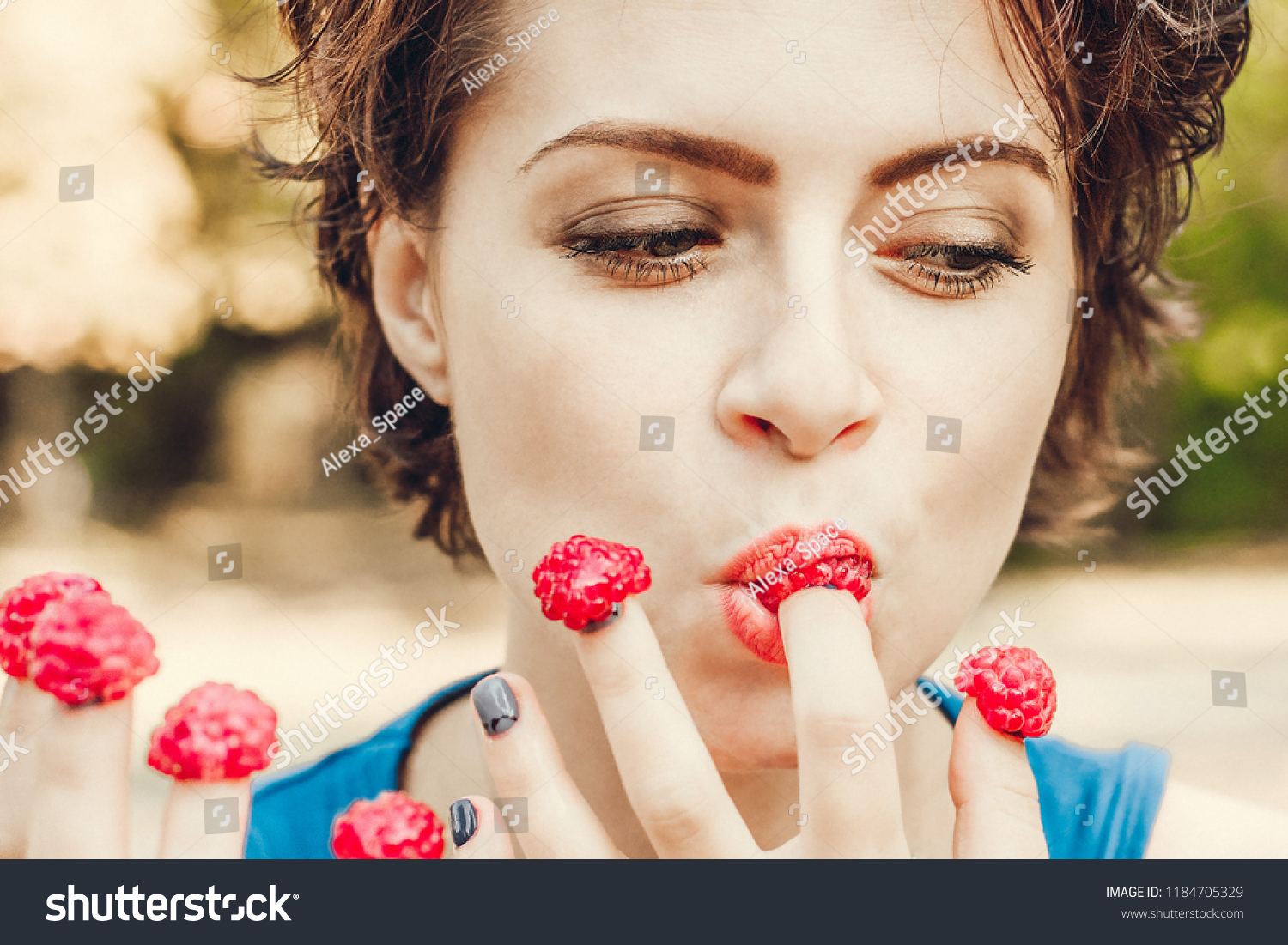 Women erotically licking their fingers